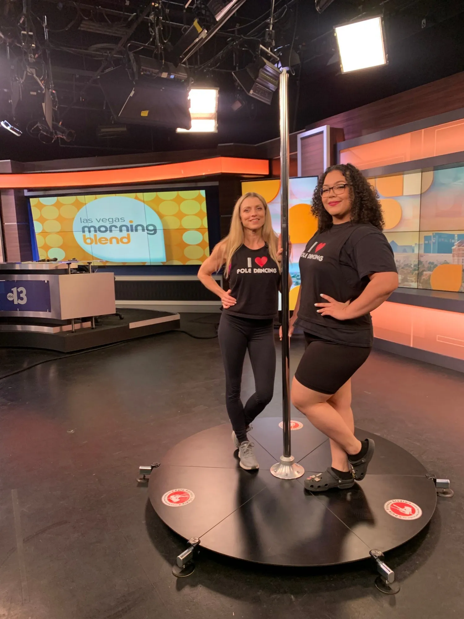 Two instructors with a Lupit pole stage on the Las Vegas Morning Blend TV set